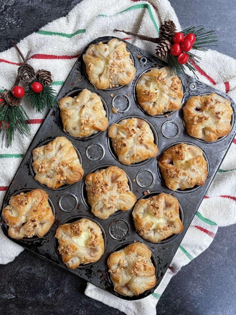 Once made, these Mini Brie & Cranberry Puff Pastry Parcels can be eaten warm, or they can be reheated very easily just before serving.

You can also freeze them once they are baked; just reheat once they have fully defrosted in a warm oven for about 5 to 10 minutes.